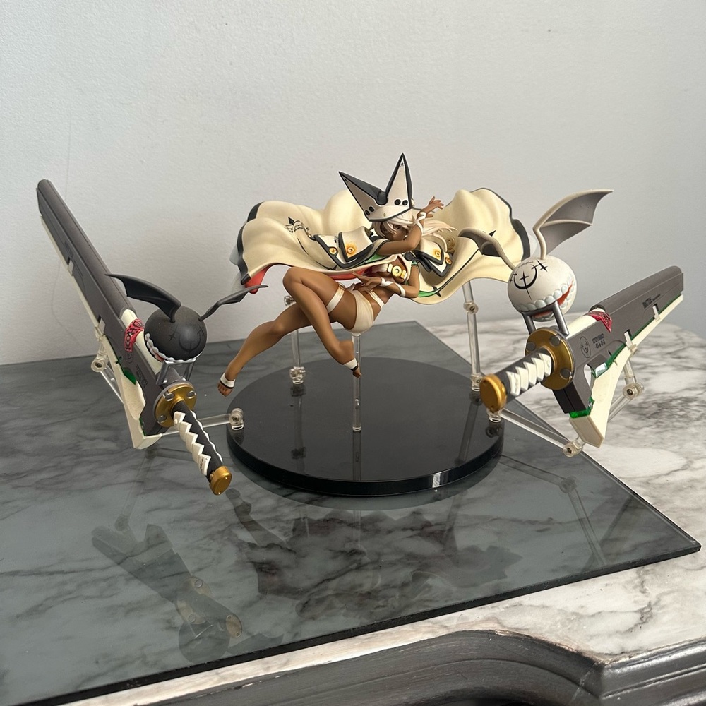 Anime Figure with Swords and Cape